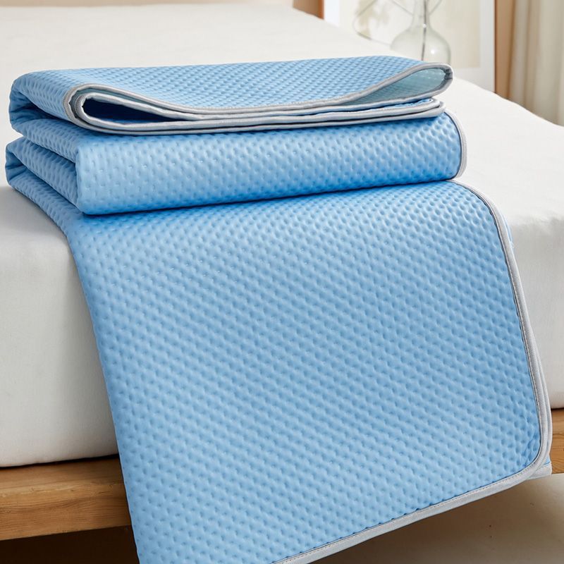 White cooling mattress topper with innovative design for superior sleep, offering support and coolness.