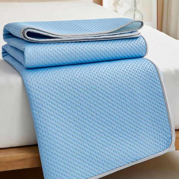 White cooling mattress topper with innovative design for superior sleep, offering support and coolness.