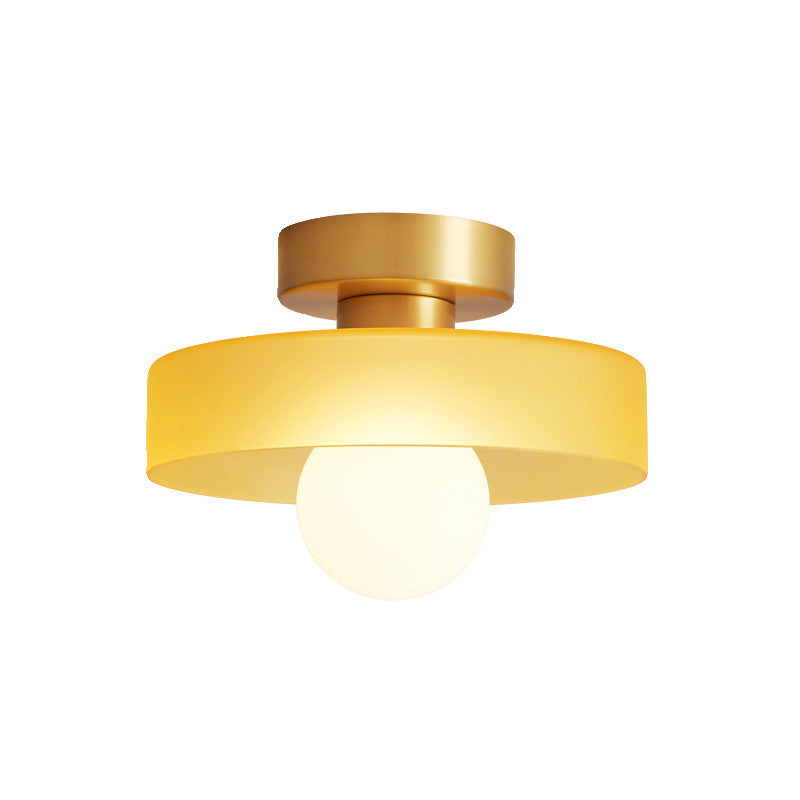 Stylish Bauhaus chandelier, brass frame with glass shades, chic home decor.