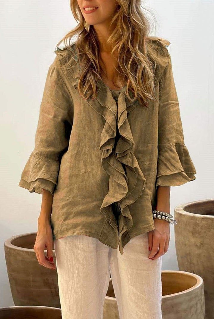Ladies' elegant ruffled 3/4 sleeve blouse, a relaxed fit top perfect for stylish casual & dressy wear.