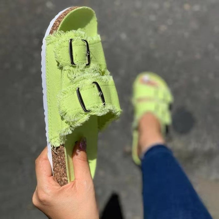 Everyday women's distressed flat sandals. Open-toe, comfortable, and chic casual footwear for summer style.