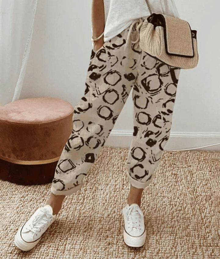 Elegant women's flowy wide-leg comfort pants, perfect for relaxed everyday wear or chic summer style.