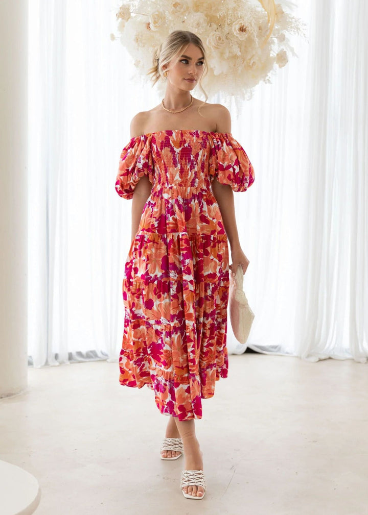 Comfortable women's short dress with vibrant floral pattern. Perfect casual summer outfit for any occasion.