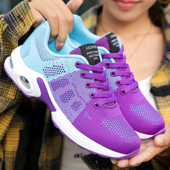 Front view: Women's walking shoes, highlighting roomy toe box & secure lacing for walking comfort.