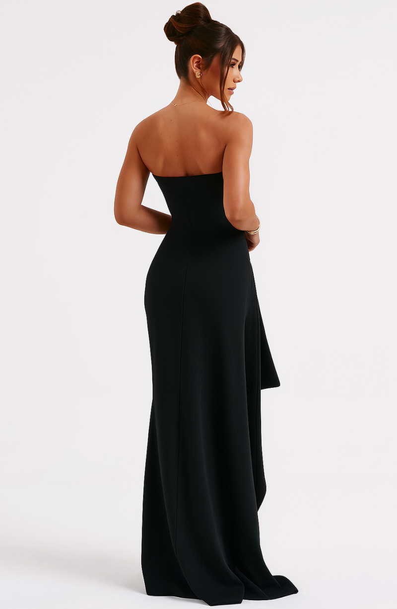 Chic women's off-shoulder black maxi dress, twisted front detail. Sophisticated for special occasions.
