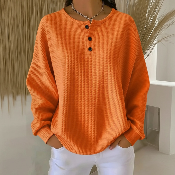 Comfortable women's long sleeve waffle knit sweatshirt, a button-front drop shoulder top for versatile casual wear.