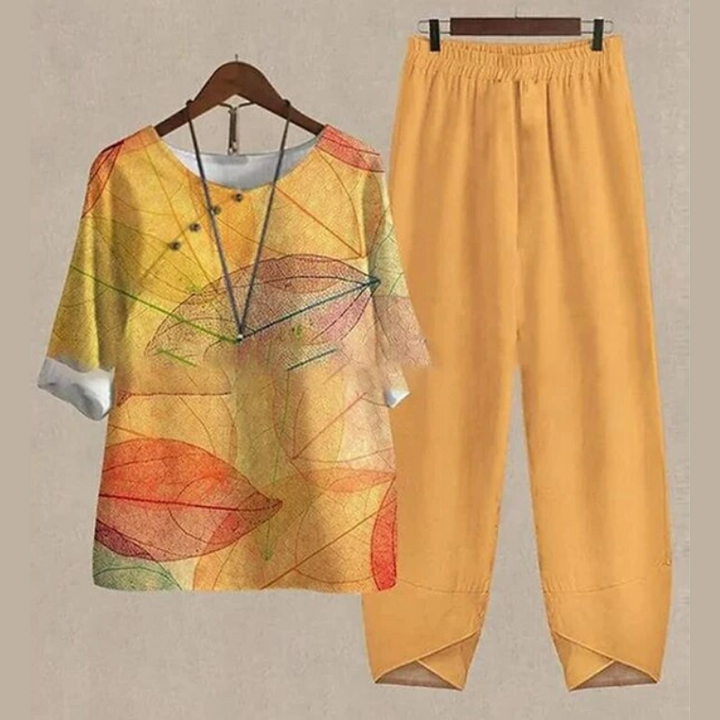 Chic women's two-piece shirt & pant set. Features a comfortable round neck, half sleeves, perfect for casual spring/summer.