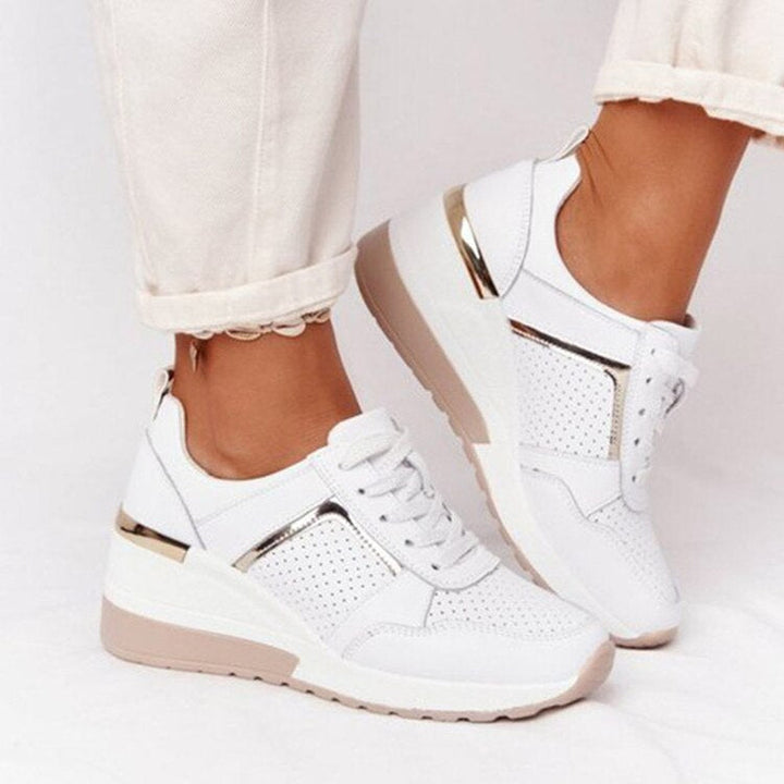 Supportive women's walking sneakers with orthopedic arch support, ensuring comfort for long walks & casual use.