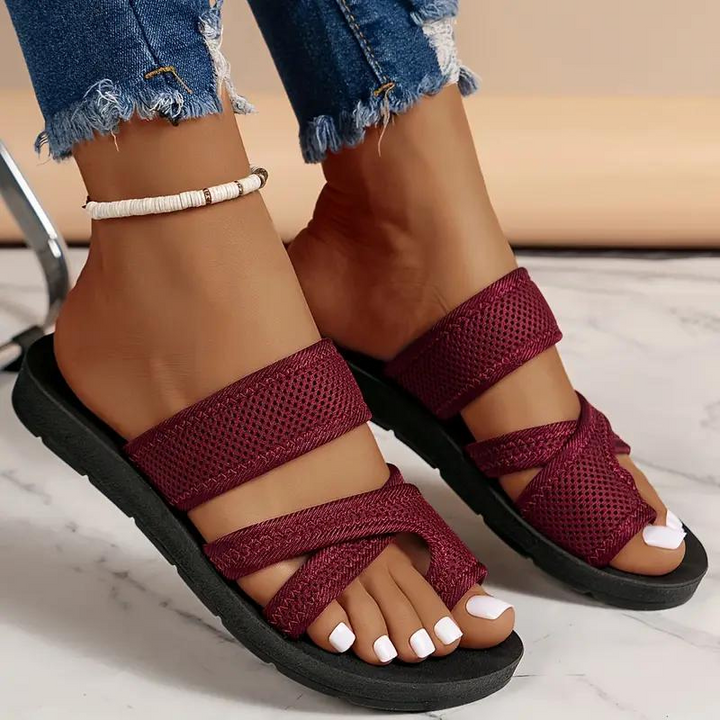 Side view of women's comfortable orthopedic slides, showcasing textured sole & slip-on design.