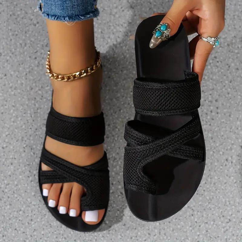 Slip-on women's slides with supportive arch, offering modern style and effortless comfort.