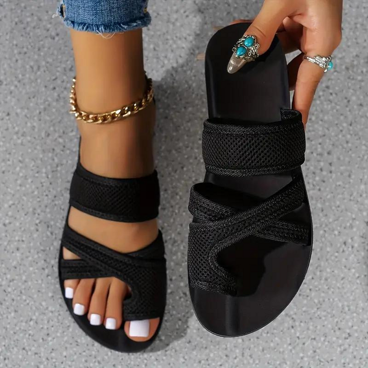 Slip-on women's slides with supportive arch, offering modern style and effortless comfort.