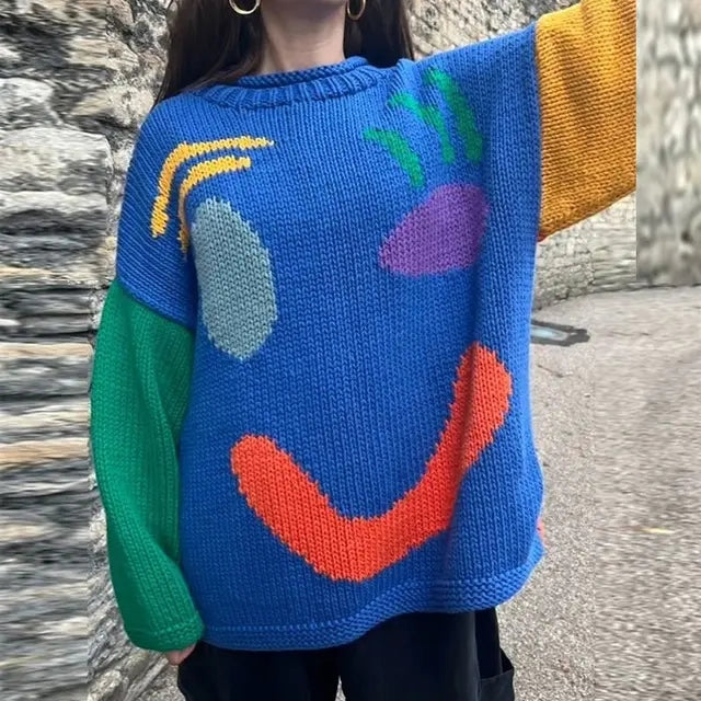 Casual women's oversized smiley face knit cardigan. Cozy, trendy long sleeve sweater for fall layering.