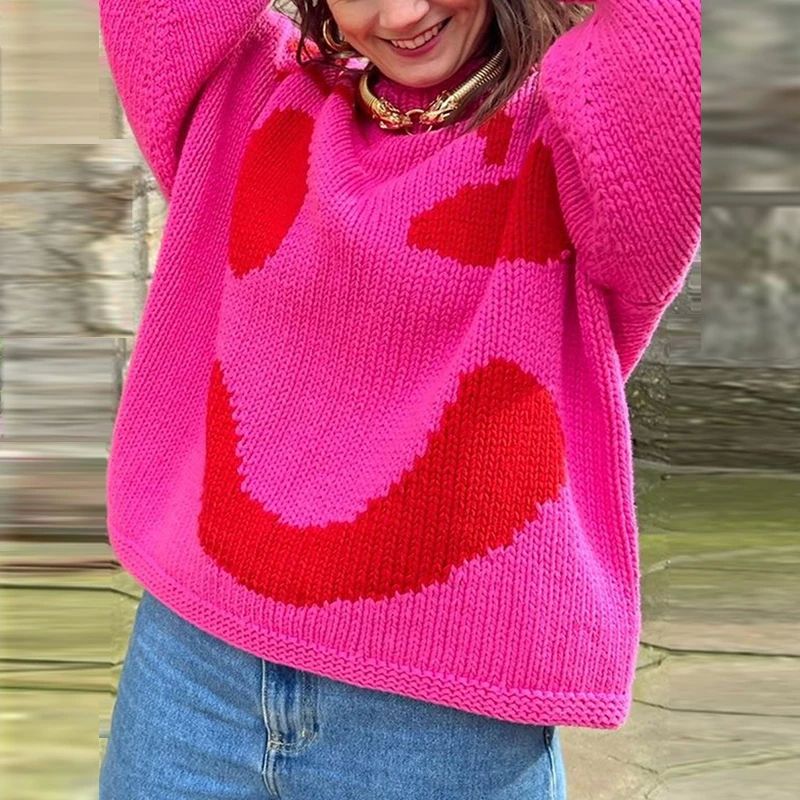 Cozy oversized women's cardigan with smiley face design. Stylish knitwear for casual fall/winter fashion.