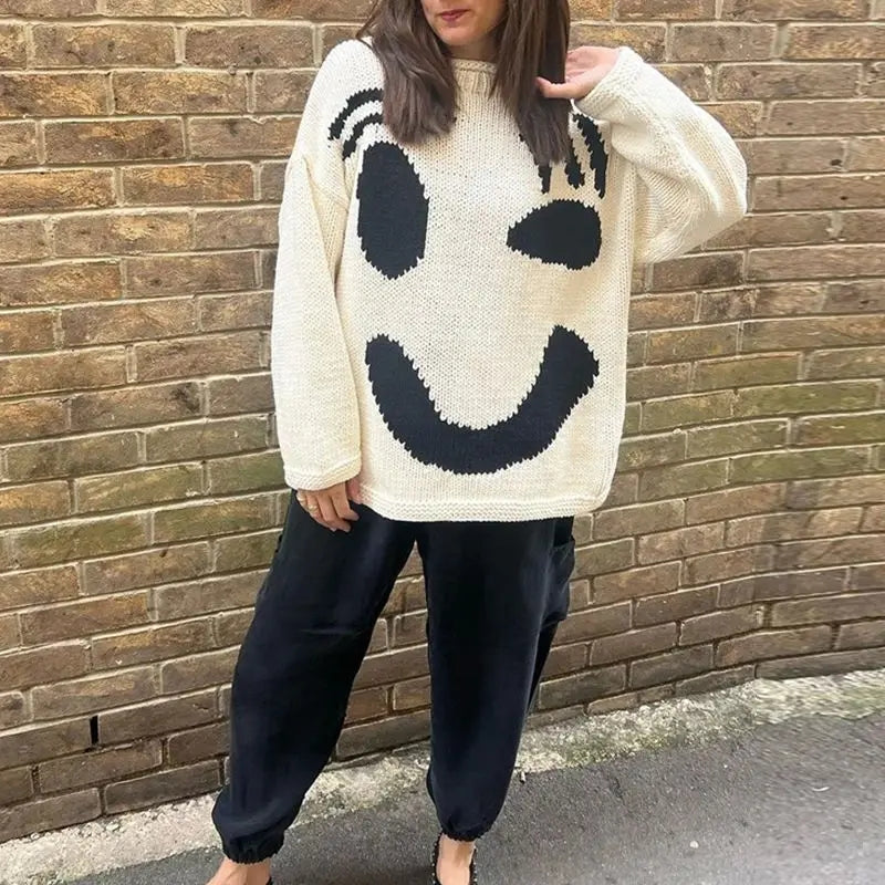 Trendy women's oversized smiley face long sleeve cardigan sweater. Cozy knitwear for casual fall & winter wear.