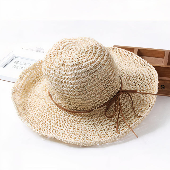 Versatile women's foldable wide-brim sun hat, a chic summer accessory for travel, beach, garden, and UV protection.