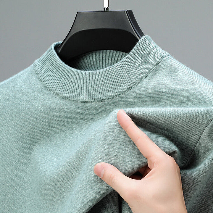 Premium comfort men's long sleeve knit sweater. Soft knitwear, a sophisticated wardrobe staple.