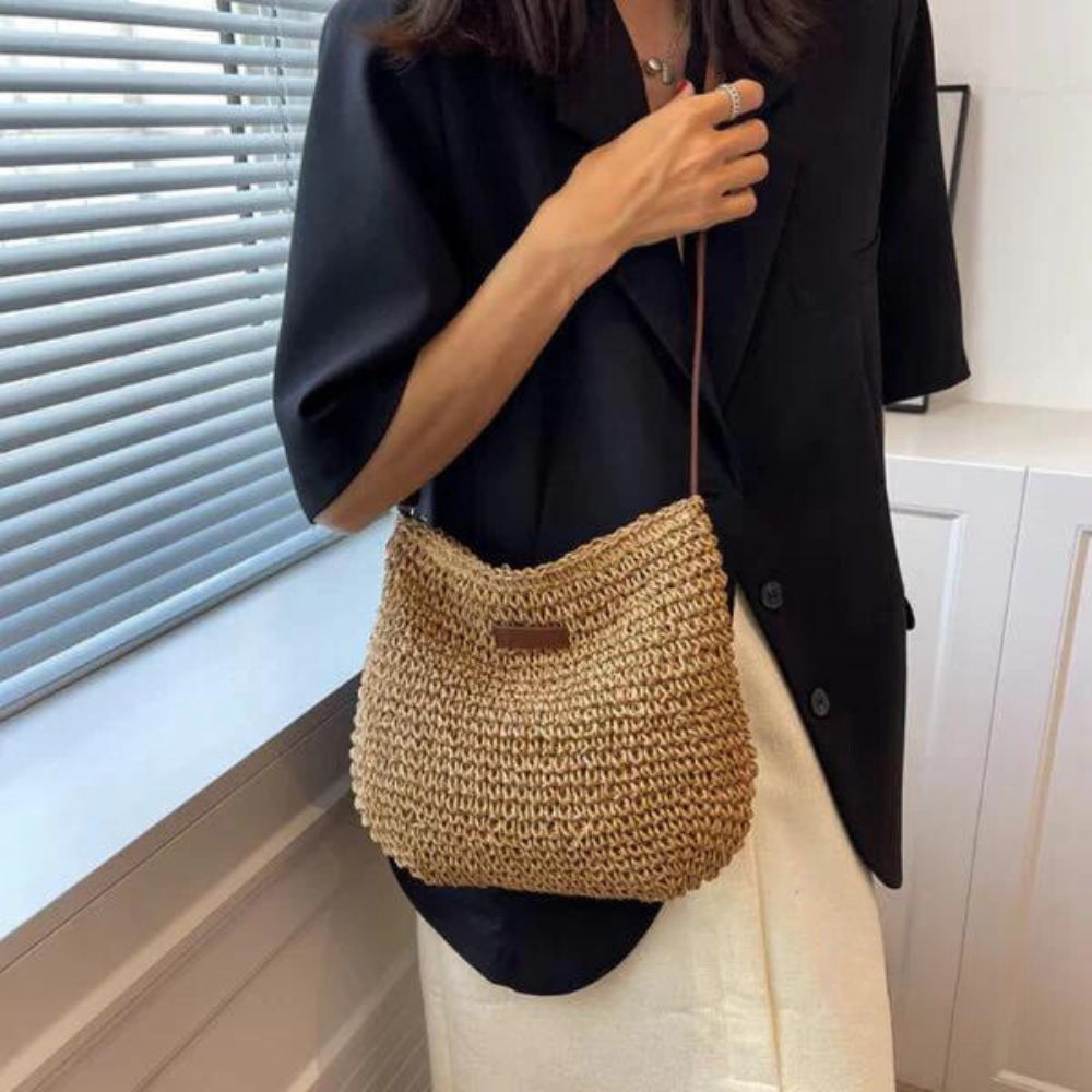 Women's chic brown woven crossbody bag, perfect for everyday fashion with an adjustable strap.