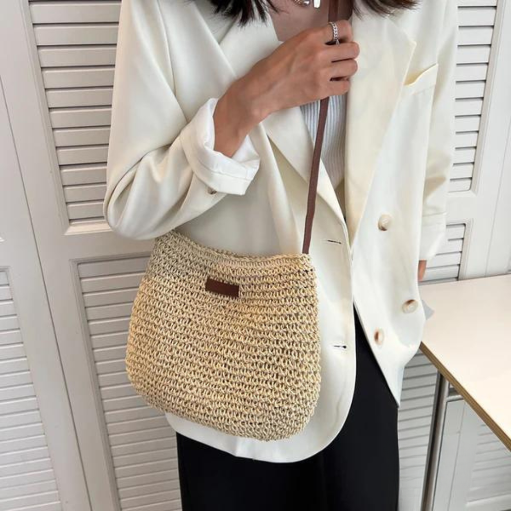 Elegant beige woven crossbody handbag for women, a practical chic fashion accessory with adjustable strap.