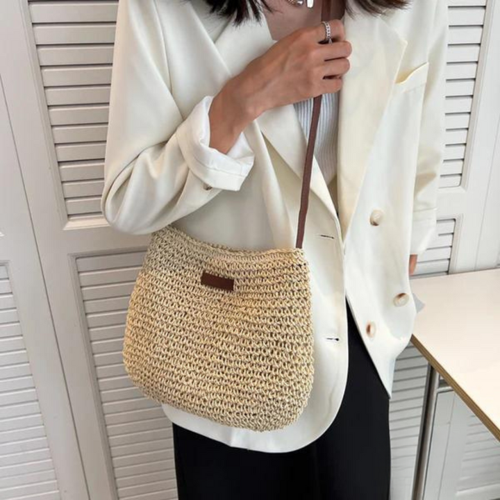 Elegant beige woven crossbody handbag for women, a practical chic fashion accessory with adjustable strap.