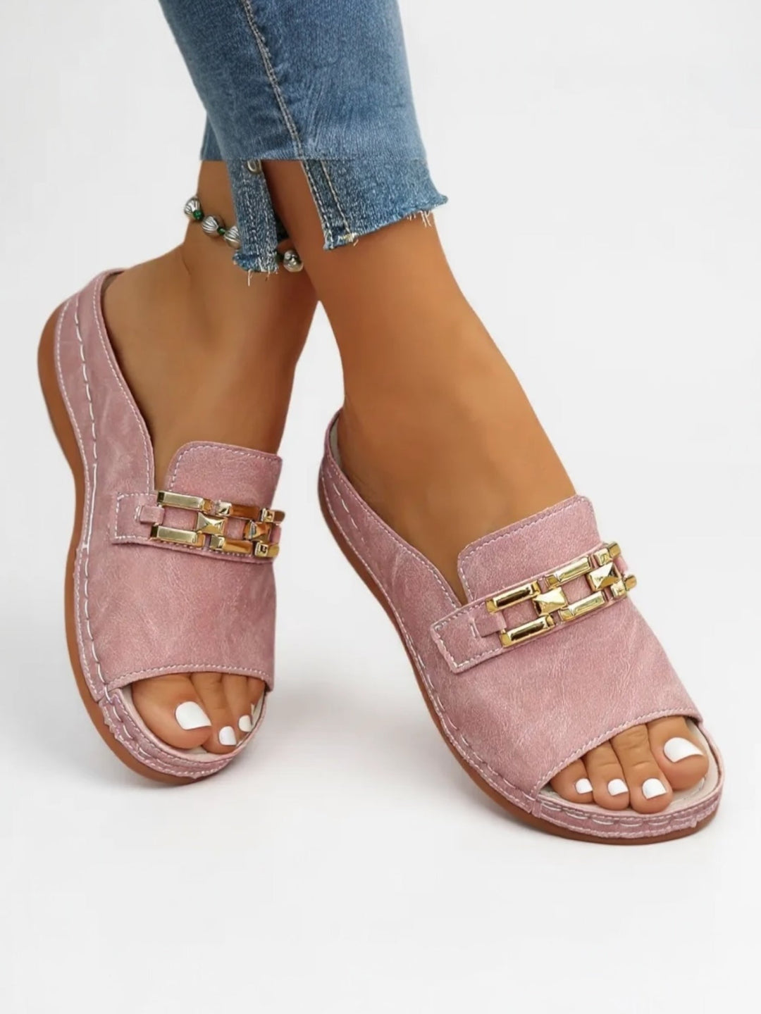 Stylish women's minimalist slip sandals featuring a soft cushioned footbed. Perfect for comfortable summer shoes.