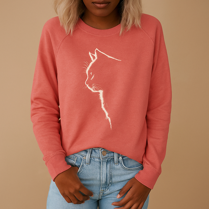 Women's cozy long-sleeve sweater with an adorable playful cat print. Perfect graphic top for casual, relaxed style.