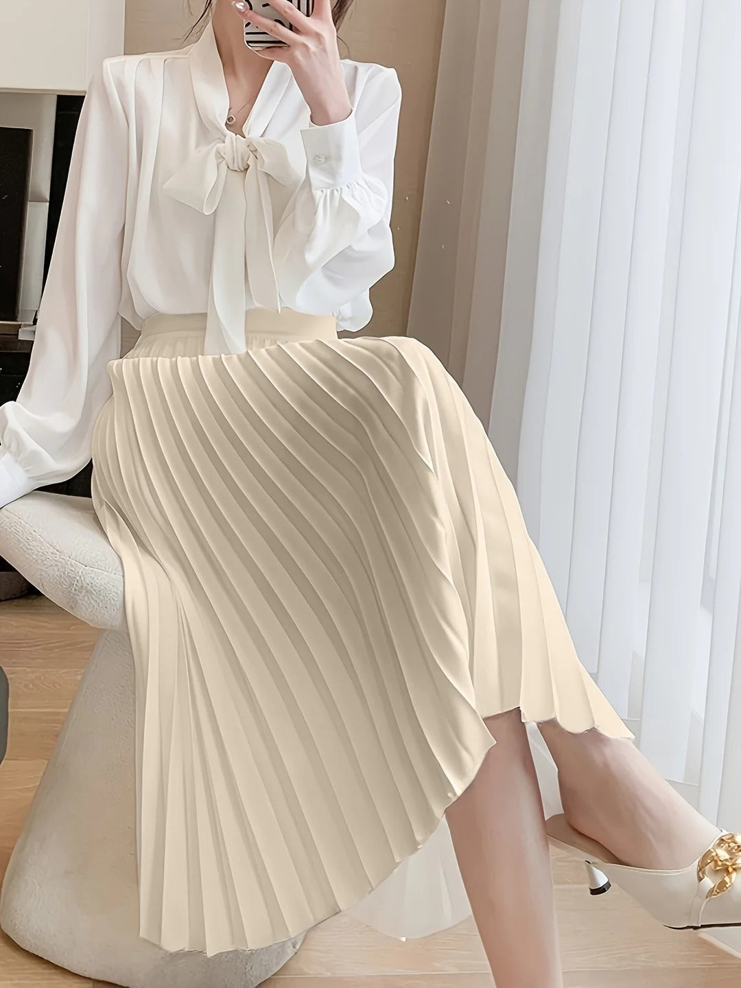 Flattering A-line high-waist pleated midi skirt for women, designed for comfortable and chic everyday elegance.