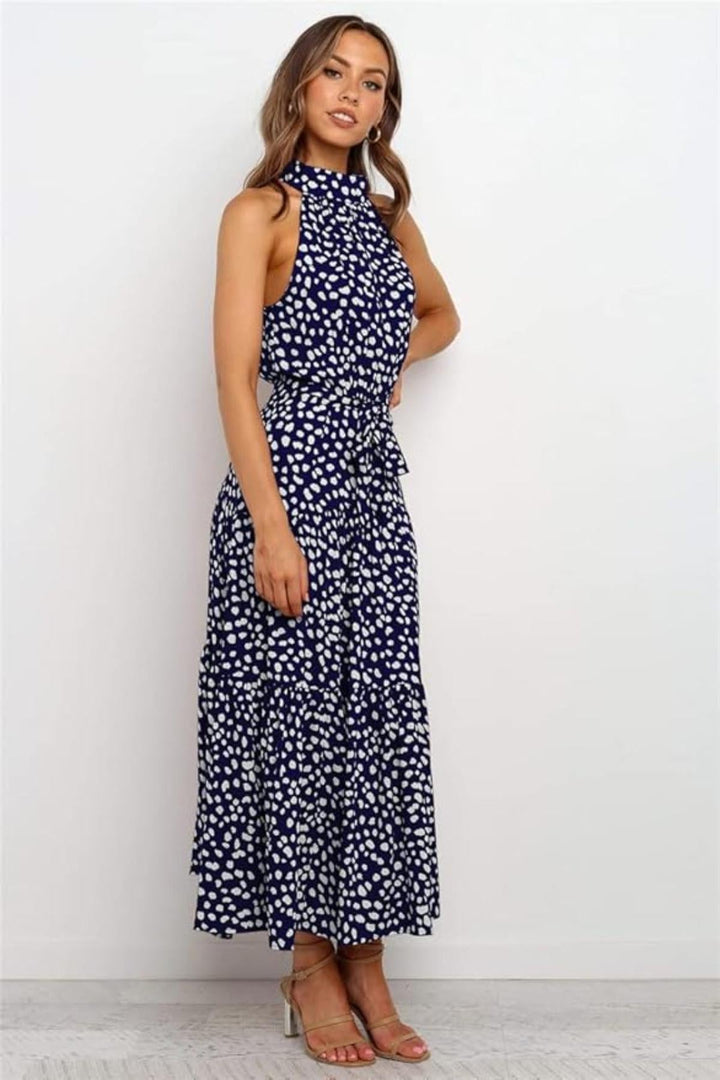 Vibrant red polka dot halter midi dress for women, a playful summer fashion statement.