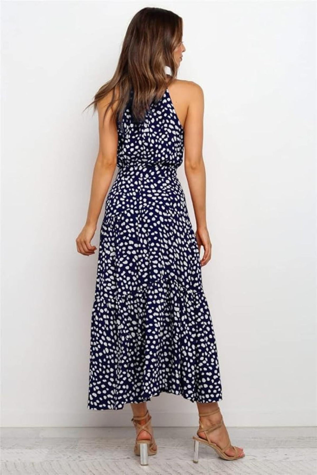 Navy blue polka dot halter midi dress, a flattering summer day dress for women.