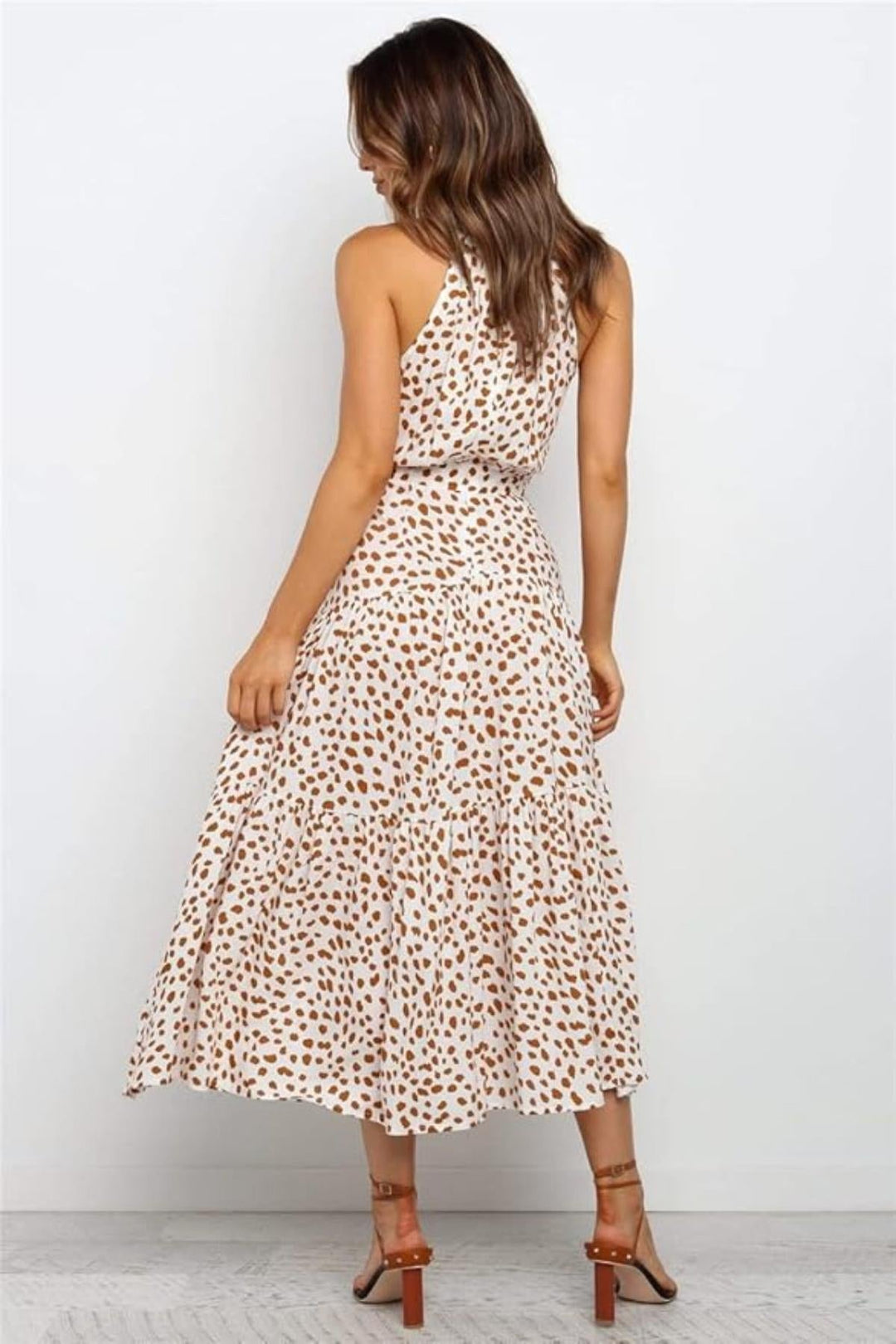 Flared polka dot halter midi dress for women, offering a comfortable and stylish summer look.