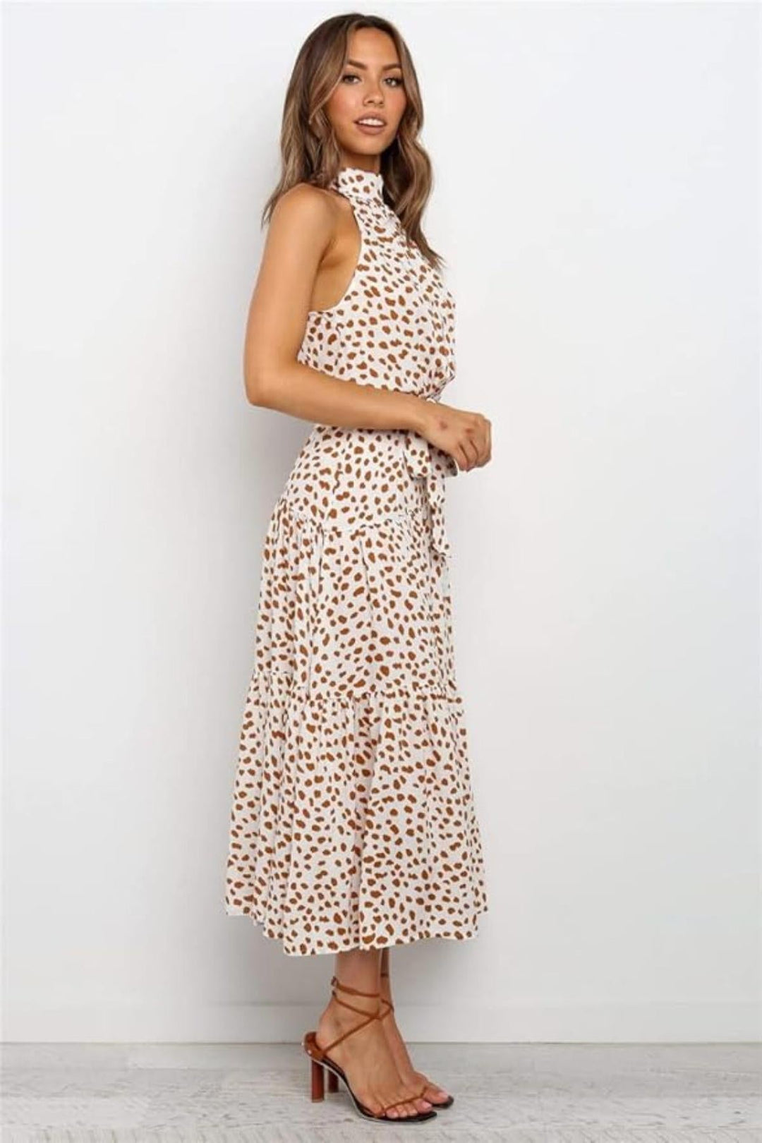 Chic women's halter neck polka dot midi dress, a must-have for summer fashion and comfort.
