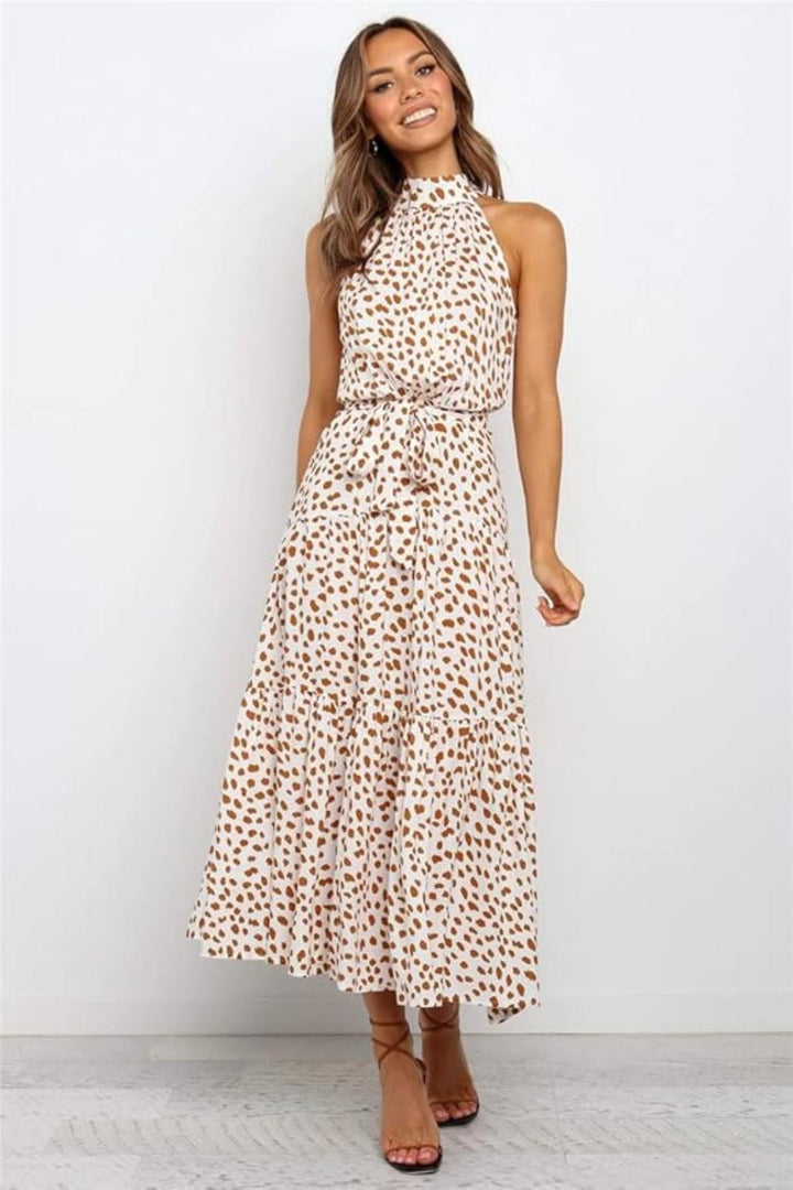 Classic polka dot print on a women's halter midi dress, ideal for summer gatherings.