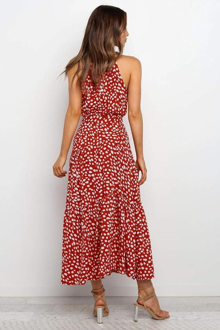 Elegant women's polka dot halter midi dress, perfect for a sophisticated summer day out.