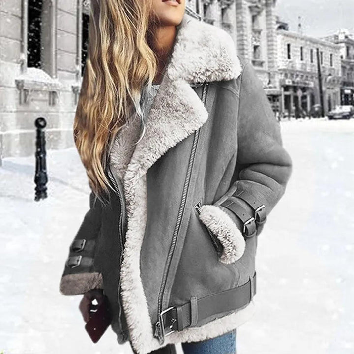 Fashionable women's winter jacket, belted for a flattering fit, with convenient pockets.