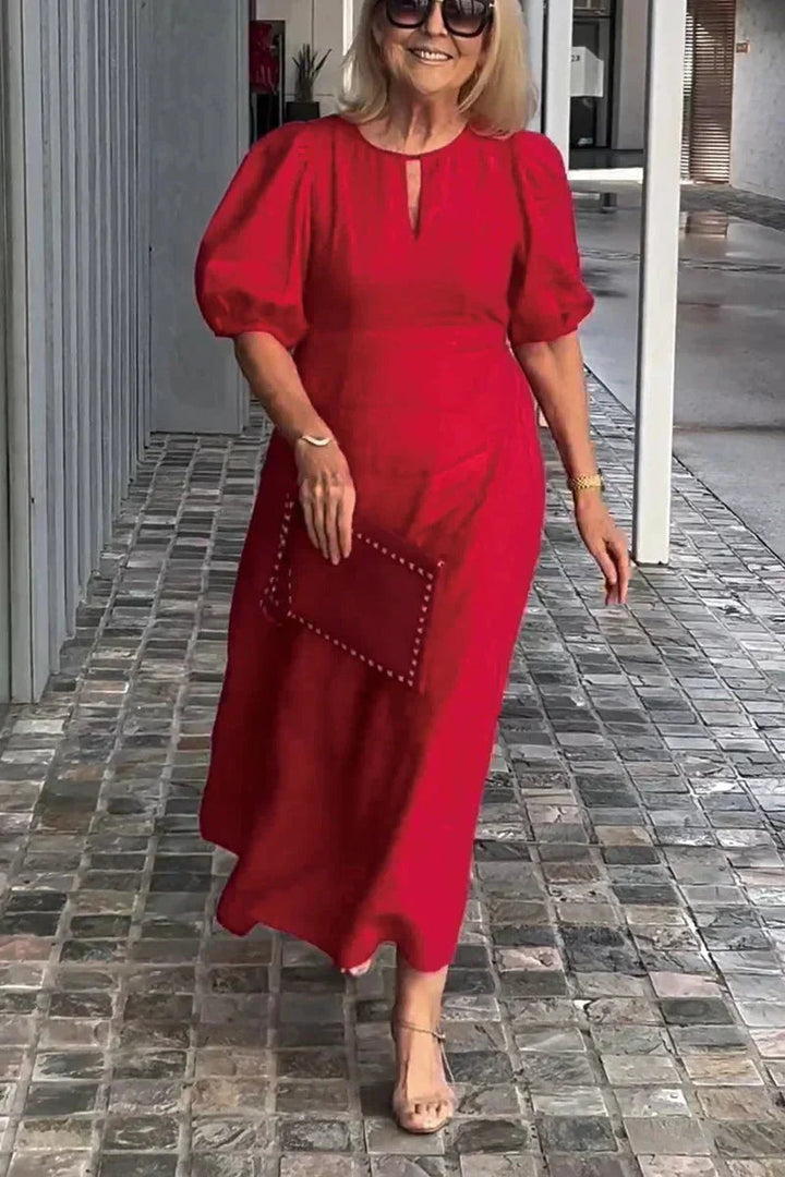 Elegant women's A-line midi dress with puff sleeves. Versatile for casual or office wear.