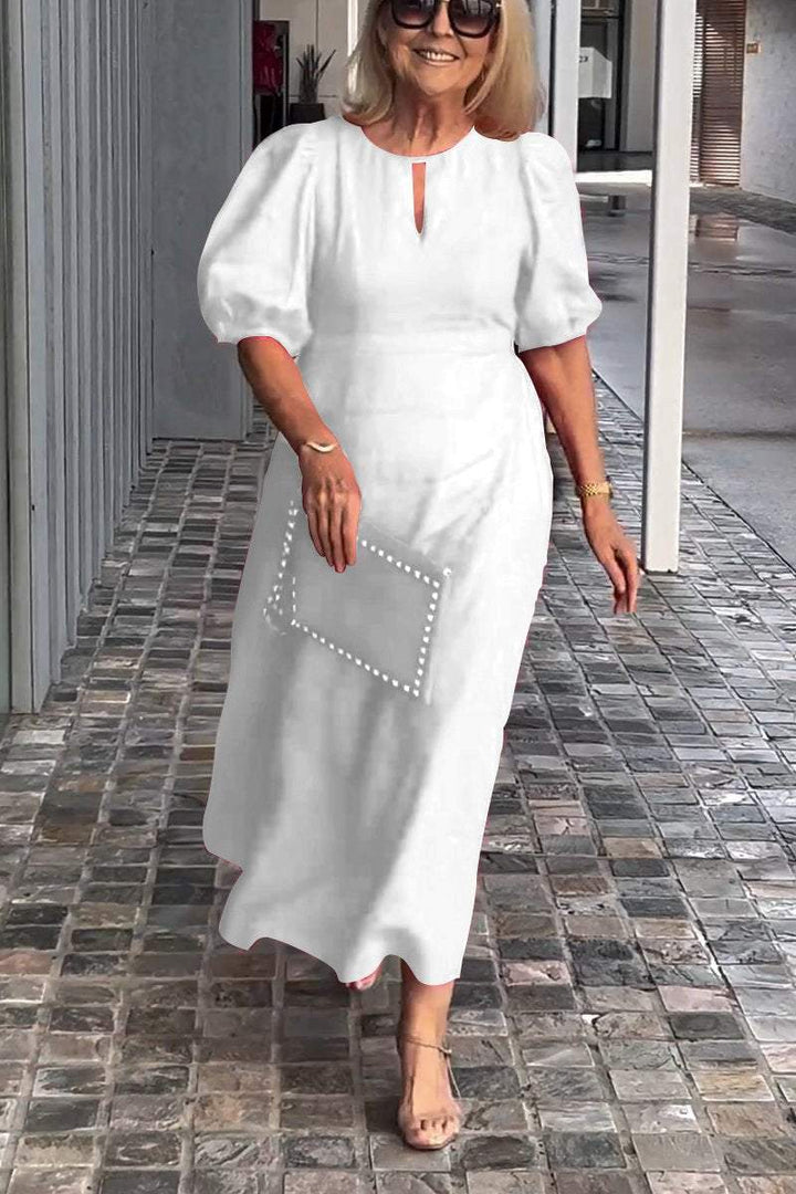 Comfortable & timeless women's A-line midi dress with puff sleeves. Versatile for any season.
