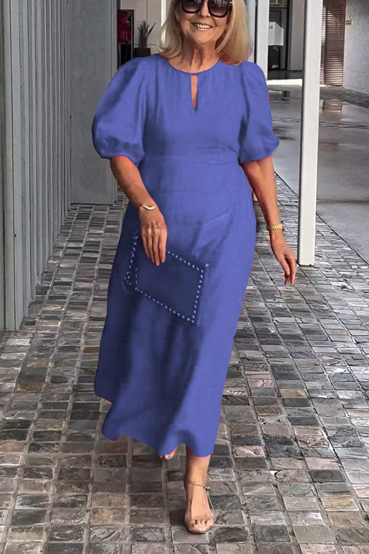 Stylish women's puff sleeve A-line midi dress. Elegant spring & summer fashion for versatile looks.