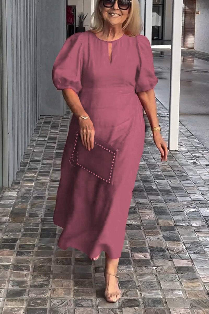 Sophisticated women's A-line midi dress with puff sleeves, perfect for chic office attire or casual.