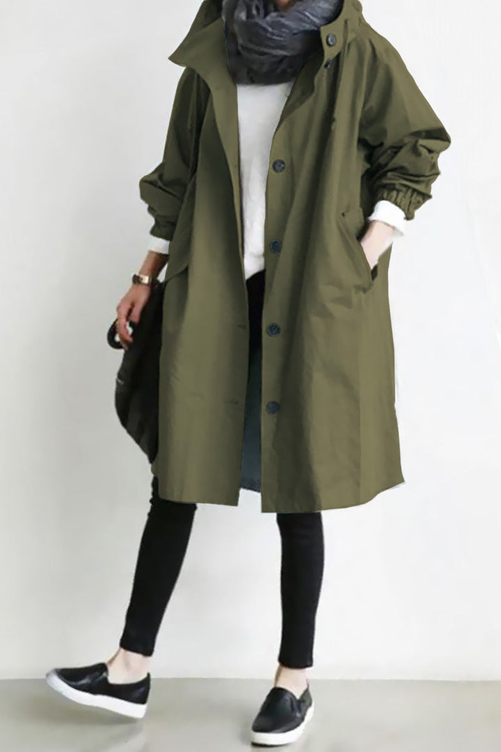 Women's oversized windbreaker, hooded & water-resistant. Perfect for outdoor adventures & travel.