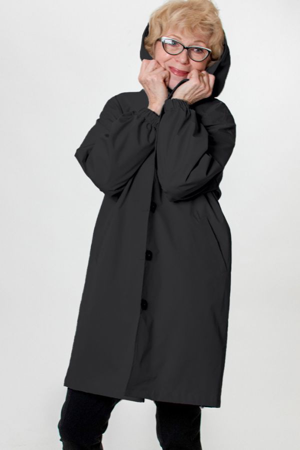 Lightweight women's packable windbreaker with hood. Oversized fit, water-resistant for active wear.