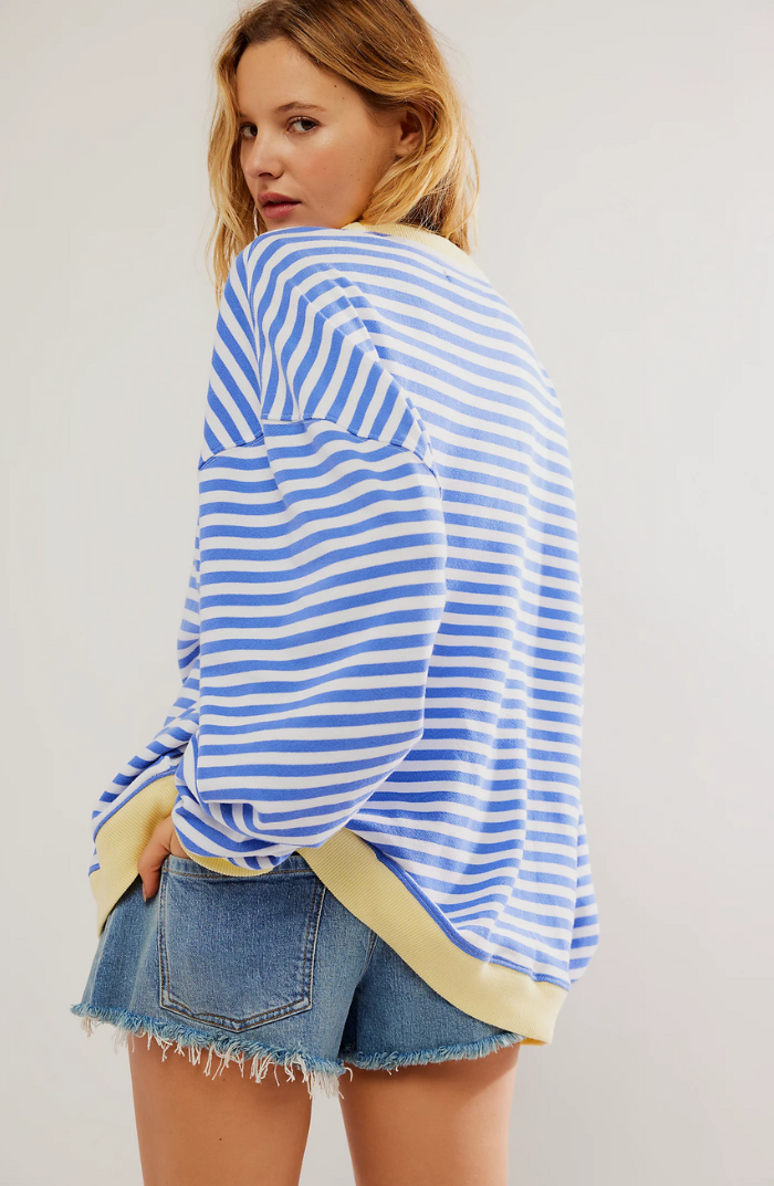 Comfortable women's oversized sweater with stylish stripes, ideal for casual layering.