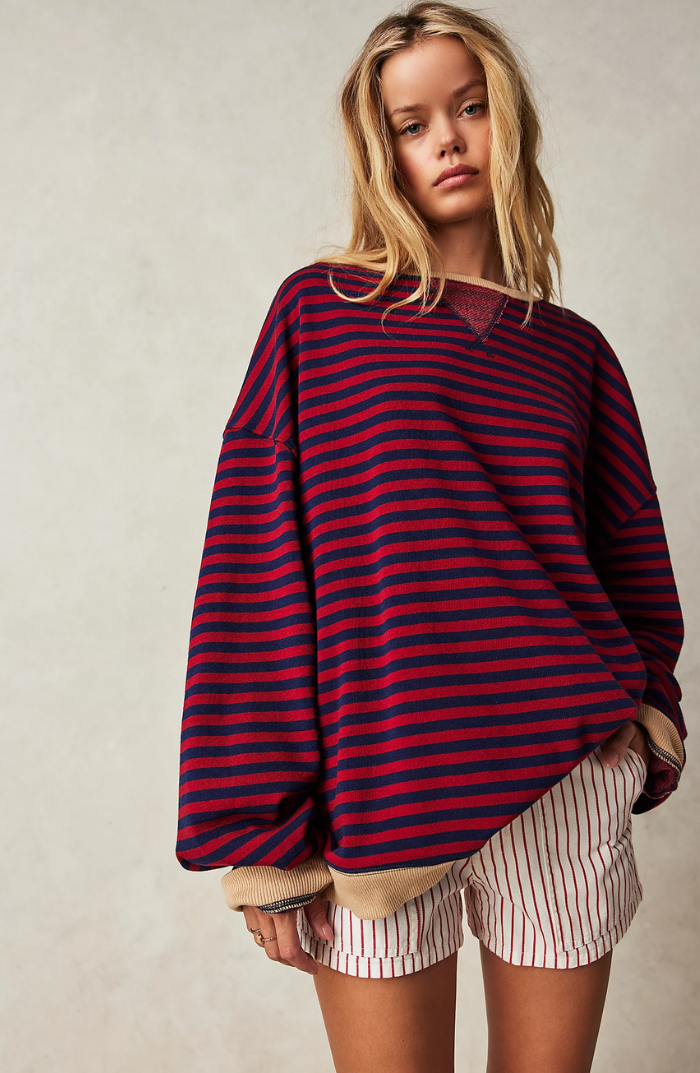 Soft & cozy striped women's sweater, offering an effortless, relaxed fit for everyday wear.