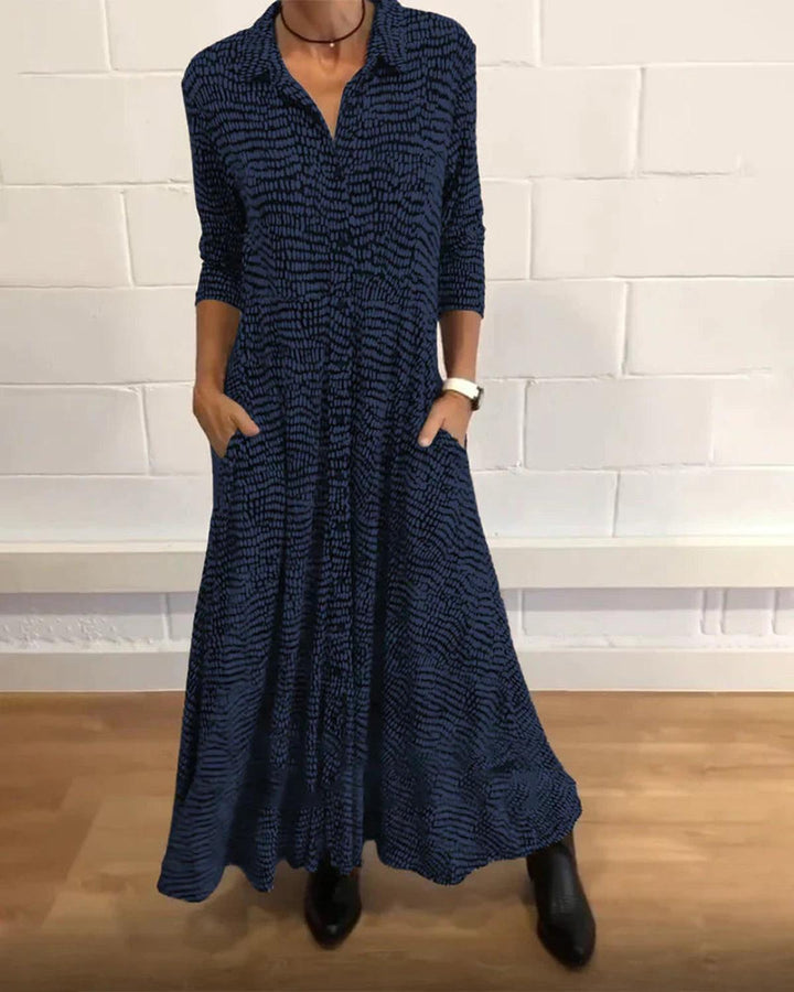 Women's summer V-neck maxi dress with a relaxed fit, offering comfortable style for warm weather fashion.