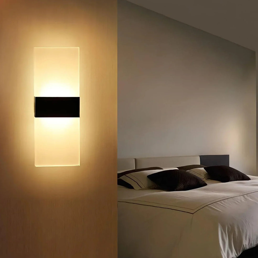 Stylish indoor LED wall light with motion sensor, adds modern ambient light to any home decor.