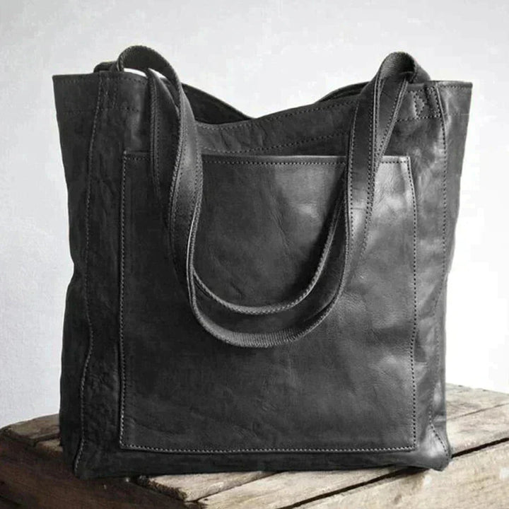 Stylish women's leather everyday carryall bag, a classic brown shoulder purse perfect for fashion and daily use.