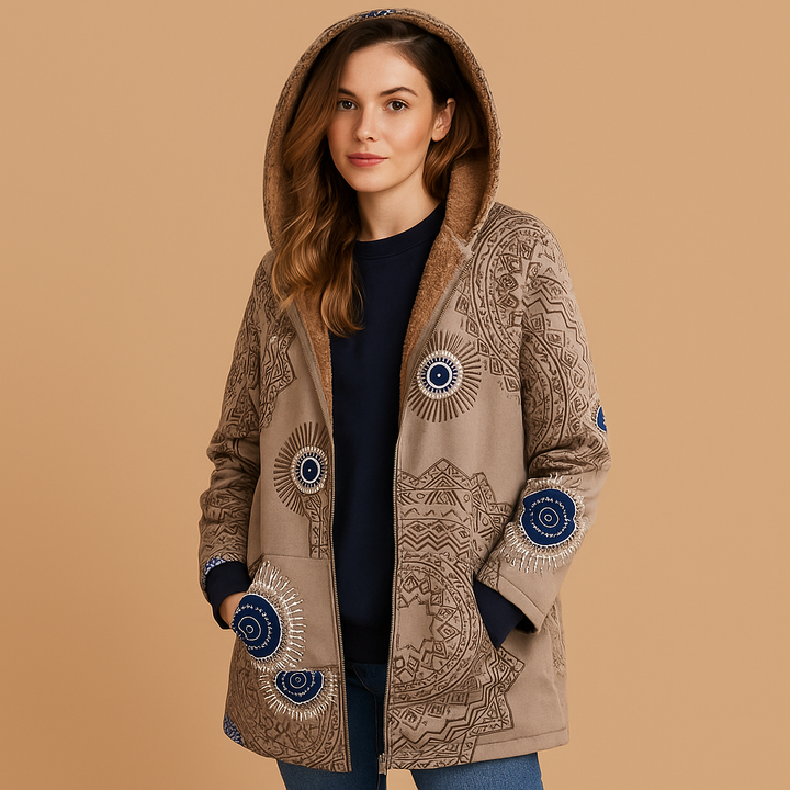 Warm women's reversible hooded winter coat, insulated & suitable for fall, travel, and everyday wear.