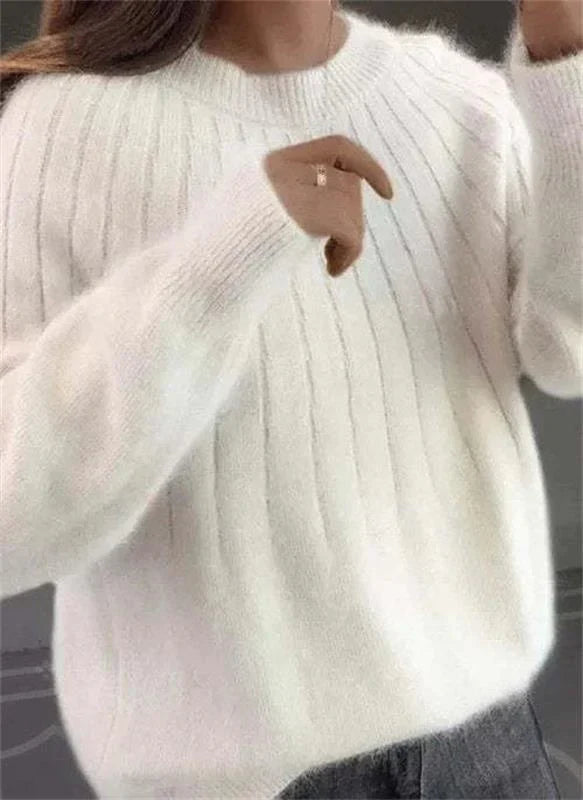 Woman wearing a comfortable and cozy long-sleeve ribbed knit sweater, ideal for everyday chic style.