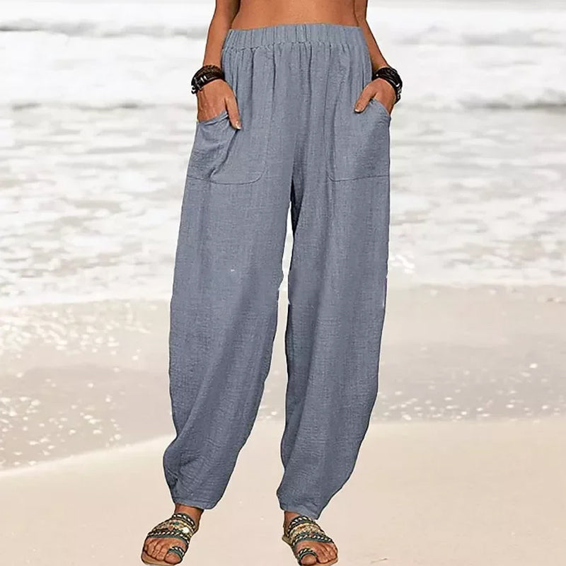 Comfortable wide leg beach pants for women. Relaxed fit summer trousers with pockets for vacation.
