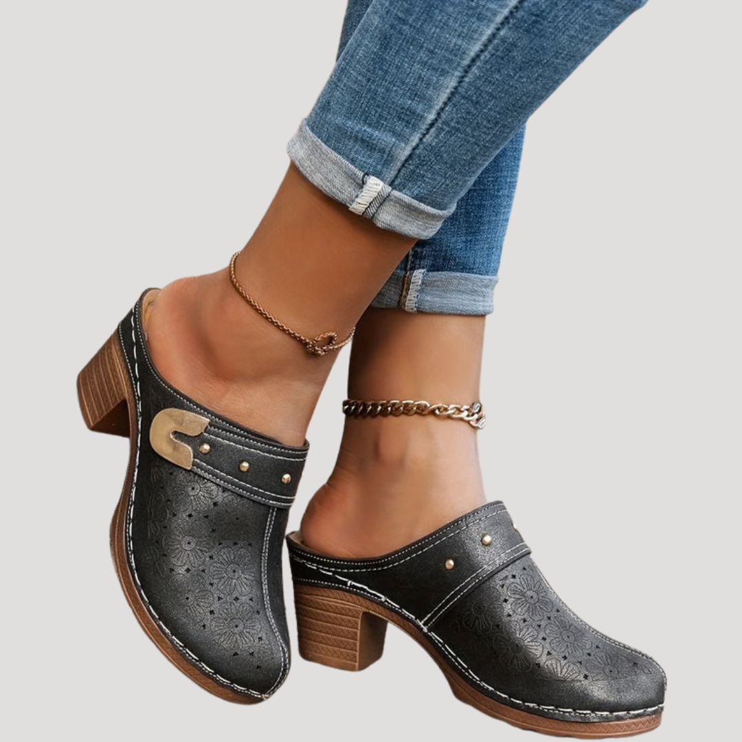 Women's embossed clog mules with block heel & buckle accent. Stylish & comfortable slip-on footwear.