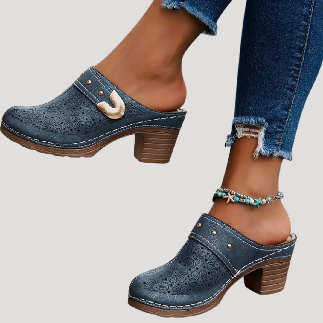 Textured embossed women's clog mules featuring a comfortable block heel and chic buckle accent.