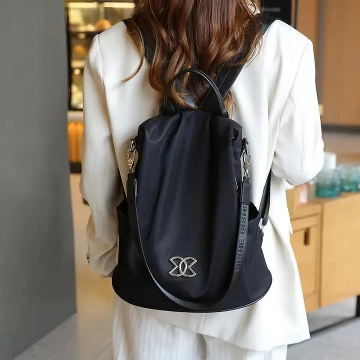 Sleek anti-theft shoulder bag, perfect for daily use, secure storage for laptops & essentials. Unisex modern backpack.